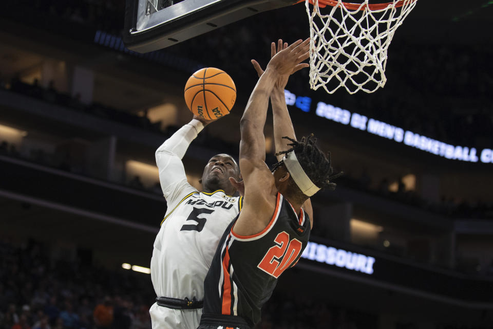 Missouri guard D'Moi Hodge (5) has his shot blocked by Princeton forward Tosan Evbuomwan (20) during the second half of a second-round college basketball game in the men's NCAA Tournament, Saturday, March 18, 2023, in Sacramento, Calif. Princeton won 78-63. (AP Photo/José Luis Villegas)