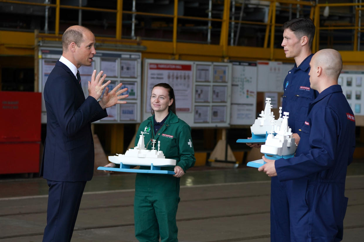 GLASGOW, SCOTLAND - JUNE 29: Prince William, the Earl of Strathearn receives models of Royal Navy warships as gifts from staff during a visit to the BAE Systems shipyard to observe construction of HMS Glasgow, the Royal Navy's first City-class Type 26 frigate on June 29, 2021 in Glasgow, Scotland. (Photo by Andrew Milligan - WPA Pool/Getty Images)