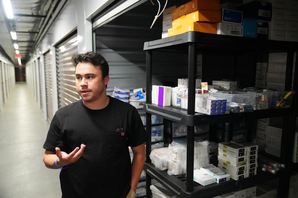 Brandon Lopez, founder of The Embrace Foundation, finds insulin to send to people with diabetes inside a storage company in Chandler where the company operates.