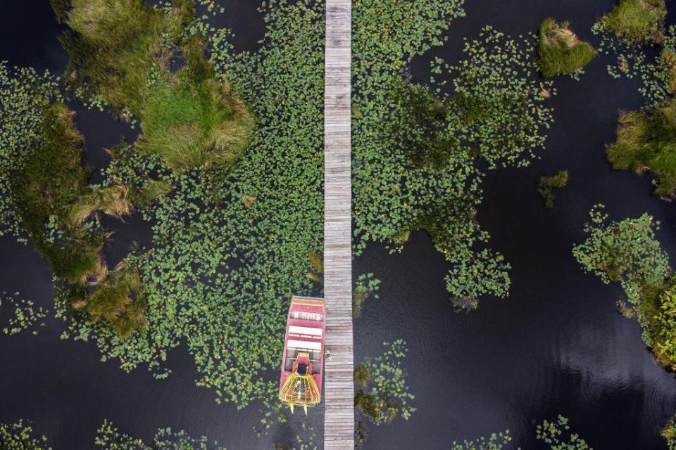 A airboat is seen docked in wetlands in Everglades National Park, Florida on September 30, 2021.