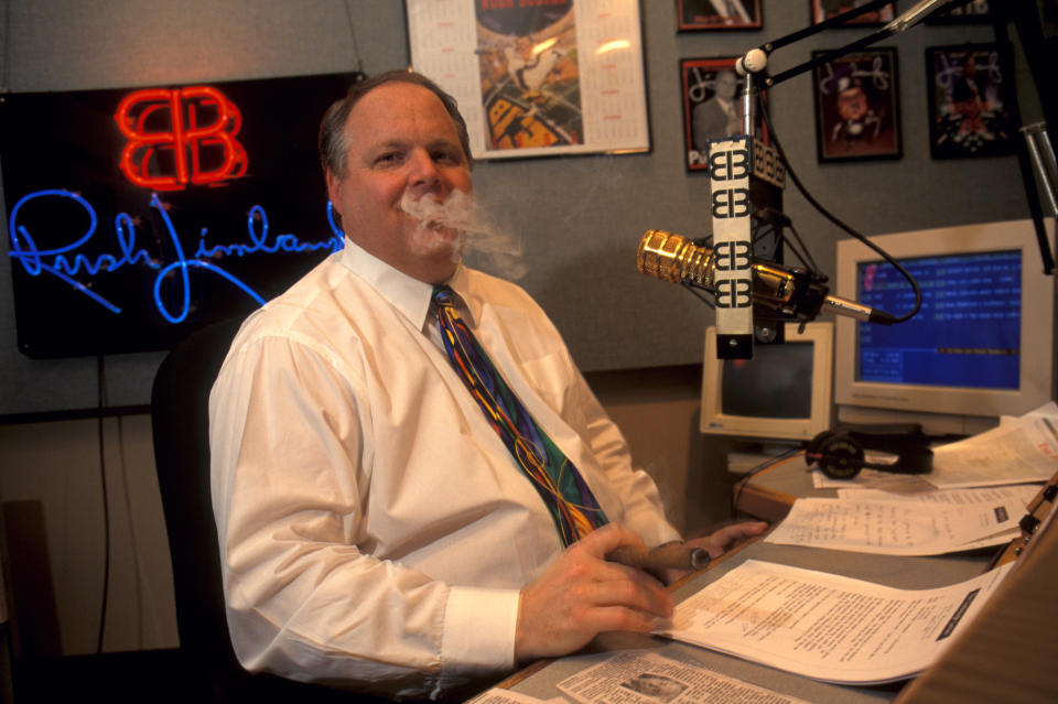 Rush Limbaugh smoking a cigar while taping his radio show. (Photo: mark peterson via Getty Images)