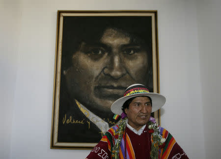 Bolivia's President Evo Morales poses in front of a painting of himself after the inauguration of the Orinoca Museum in Orinoca, Bolivia February 2, 2017. REUTERS/David Mercado