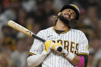 San Diego Padres' Fernando Tatis Jr. reacts as he strikes out while batting during the ninth inning of a baseball game against the San Francisco Giants, Tuesday, Sept. 21, 2021, in San Diego. (AP Photo/Gregory Bull)