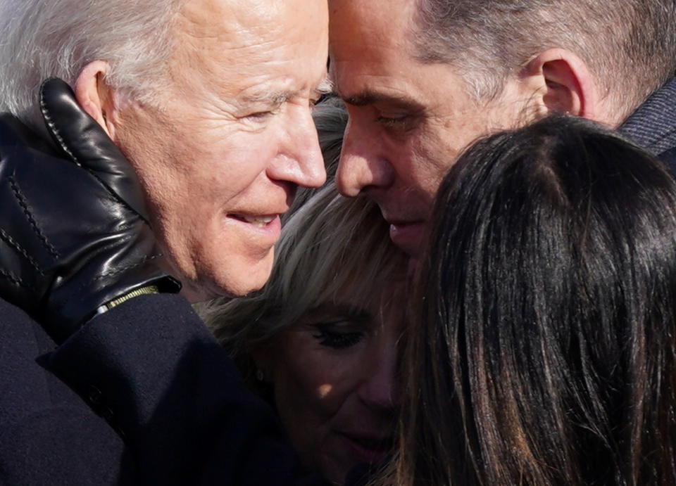 U.S. President Joe Biden embraces his family after he was sworn in as the 46th President of the United States. (Kevin Lamarque/Reuters)