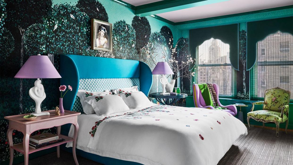 jewel colored bedroom in blues and greens with scalloped window drapery