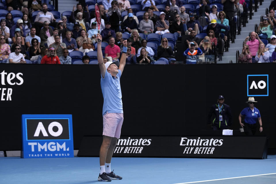 Jenson Brooksby of the U.S. celebrates after defeating Casper Ruud of Norway in their second round match at the Australian Open tennis championship in Melbourne, Australia, Thursday, Jan. 19, 2023. (AP Photo/Dita Alangkara)