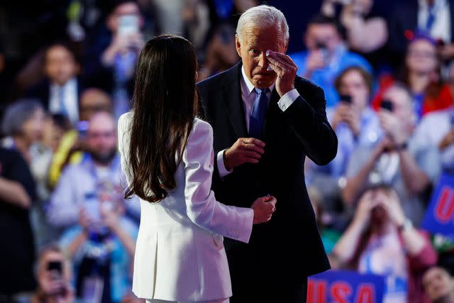 <p>Kevin Dietsch/Getty</p> President Joe Biden wipes tears after daughter Ashley Biden lovingly introduced him at the DNC on Aug. 19, 2024