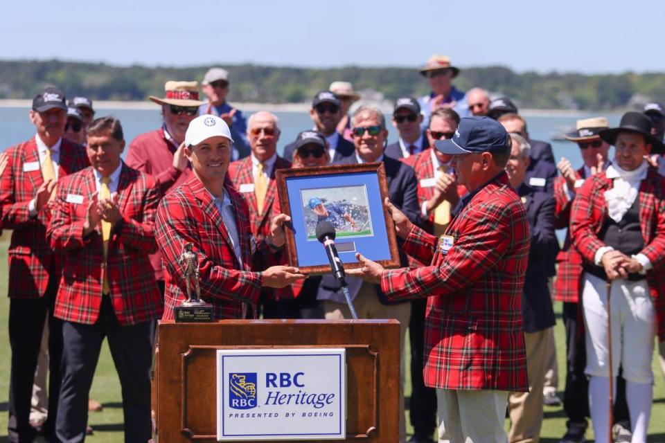 Davis Love III, right, presents a framed print to defending champion Jordan Spieth during the opening ceremony of the 2023 RBC Heritage Presented by Boeing on April 11, 2023 at Harbour Town Golf Links on Hilton Head Island. Eston Parker III/For The Island Packet