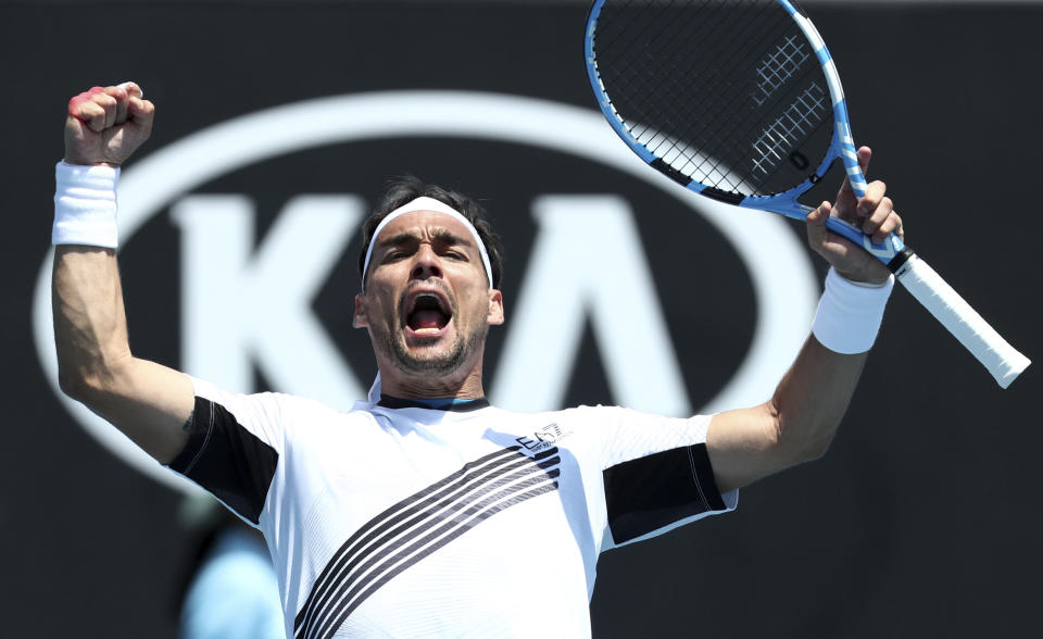 Italy's Fabio Fognini celebrates after defeating Reilly Opelka of the U.S. in their first round singles match at the Australian Open tennis championship in Melbourne, Australia, Tuesday, Jan. 21, 2020. (AP Photo/Dita Alangkara)