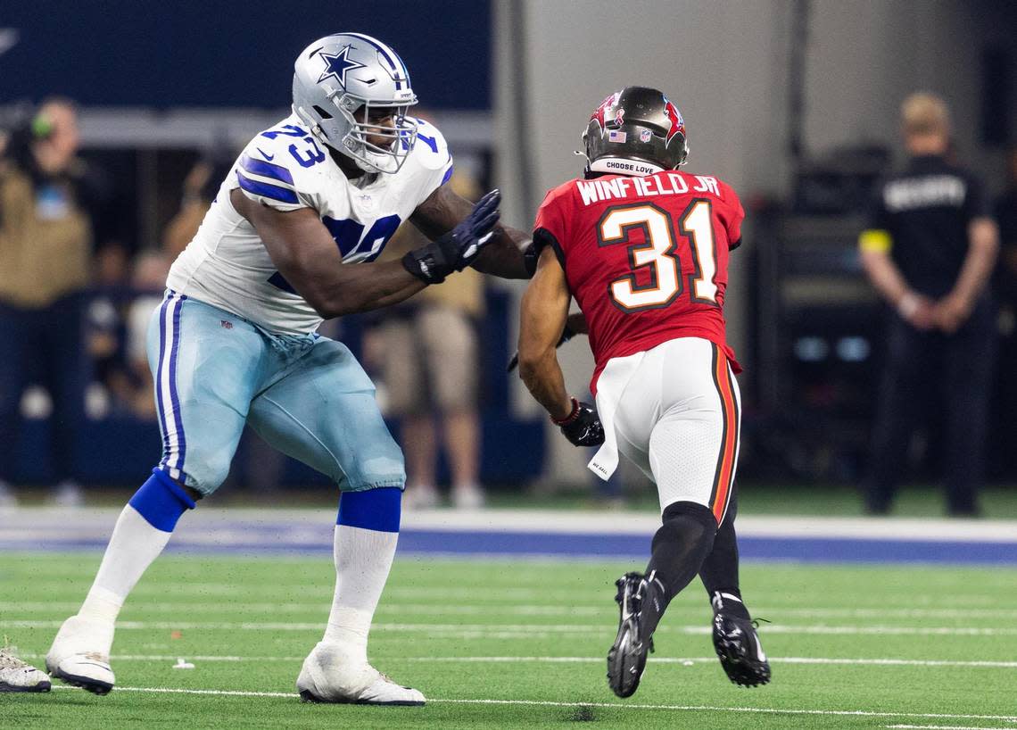 Dallas Cowboys Tyler Smith blocks Buccaneers Antoine Winfield Jr. during the second half of the game against Tampa Bay Buccaneers Sunday, Sept. 11, 2022, at AT&T Stadium in Arlington.