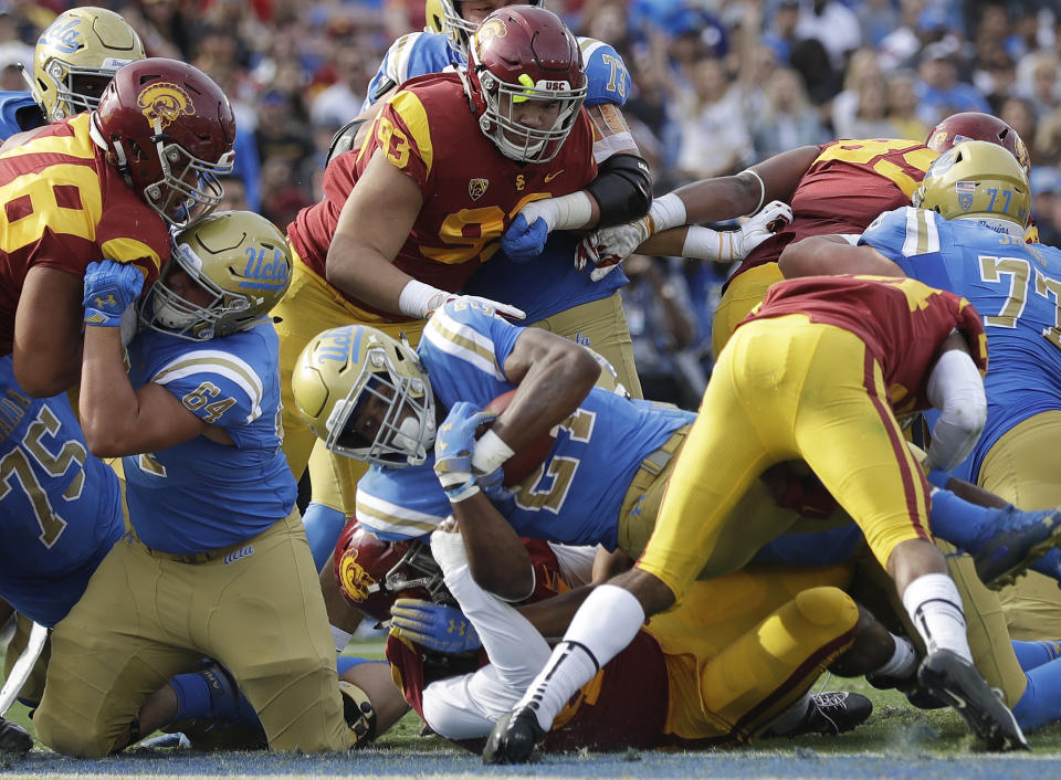 UCLA running back Joshua Kelley (27) scored a touchdown after a penalty on USC”s Brandon Pili gave his team first and goal. (AP Photo/Marcio Jose Sanchez)