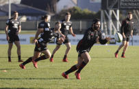 Crusaders Richie Mo'unga looks to catch the ball during a training session at Rugby Park in Christchurch, New Zealand, Wednesday, May 27, 2020. New Zealand's Super Rugby Aotearoa will start on June 13 in a new five-team, 10-week competition. (AP Photo/Mark Baker)