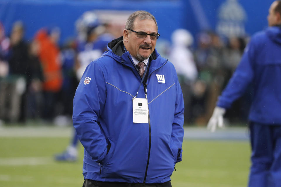 FILE - New York Giants general manager Dave Gettleman watches warm ups before an NFL football game against the Philadelphia Eagles, Sunday, Dec. 29, 2019, in East Rutherford, N.J. After three years of rebuilding and turning over the roster, general manager Dave Gettleman believes the young and feisty New York Giants are on the verge of being a competitive, winning team under new coach Joe Judge. Speaking on the record Wednesday, Sept. 2, 2020, for the first time since training camp opened last month, Gettleman believes the Giants have a solid young quarterback in Daniel Jones, a talented halfback in Saquon Barkley and some nice pieces on both sides of the ball.(AP Photo/Seth Wenig, File)