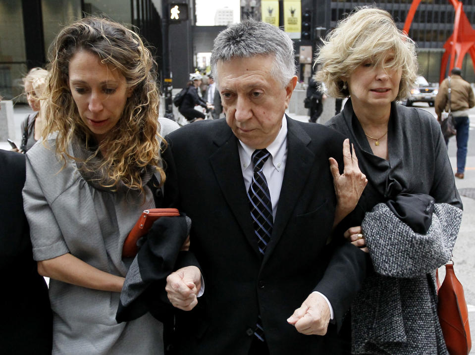 William Cellini, center, departs the federal courthouse with unidentified family members after Judge James Zagel sentenced him to 366 days in prison and a $75,000 fine Thursday, Oct. 4, 2012, in Chicago. Cellini, 77, was convicted last year for his role in trying to get a $1.5 million campaign contribution for former Gov. Rod Blagojevich from the Oscar-winning producer of "Million Dollar Baby" in exchange for state business. (AP Photo/Charles Rex Arbogast)