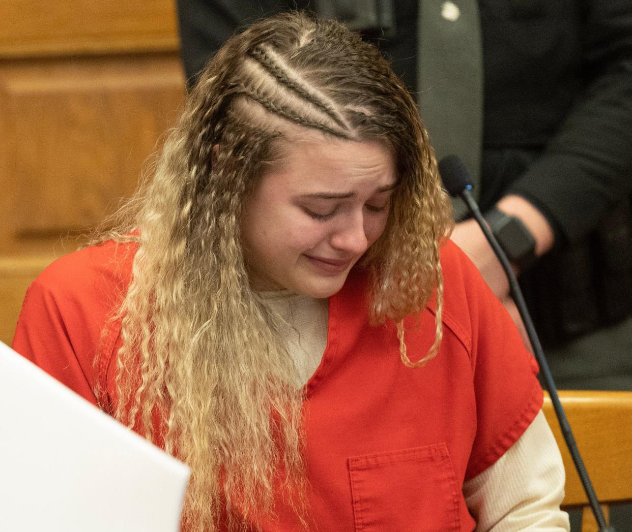 Grace N. DeWalt, 21, of Massillon becomes emotional as her mother speaks Tuesday on her behalf. Stark County Common Pleas Judge Frank G. Forchione sentenced DeWalt to 10 to 13.5 years in prison for attempted murder and other charged tied to an October shooting.
