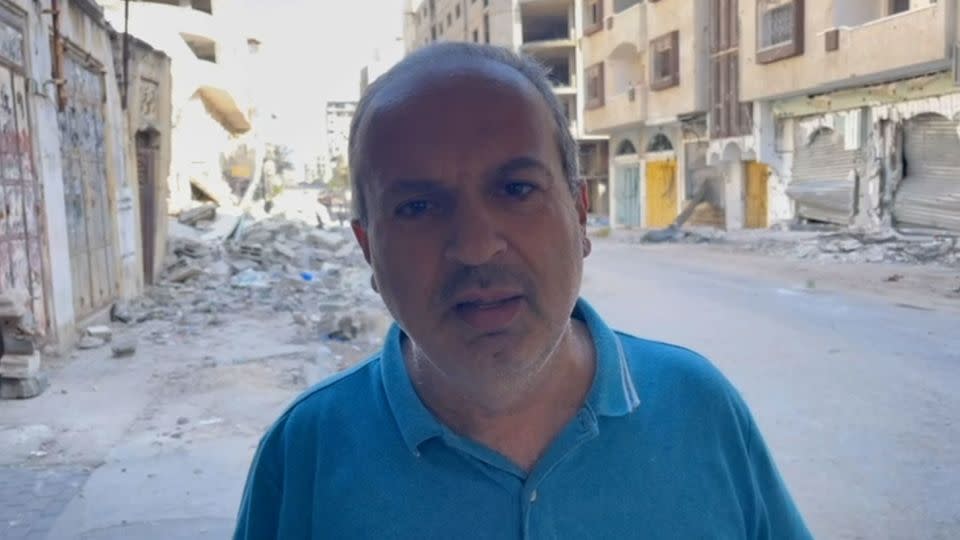 Tareq Ghanem, shown in Tal al-Hawa, in northern Gaza on July 12, told CNN that Palestinians are “dying in the streets,” as Israeli forces pull back from the area. - CNN