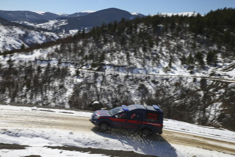 Doctors and health workers of a COVID-19 vaccination team drive into the isolated village of Gumuslu in the district of Sivas, central Turkey, Friday, Feb. 26, 2021. “It’s a difficult challenge to come here,” said Dr Rustem Hasbek, head of Sivas Health Services. “The geography is tough, the climate is tough, as you can see.” (AP Photo/Emrah Gurel)