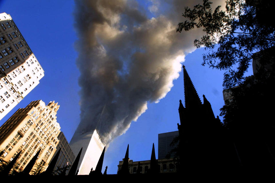 <p>Smoke spews from a tower of the World Trade Center Sept. 11, 2001, after two hijacked airplanes hit the twin towers in a terrorist attack on New York City. (Photo: Mario Tama/Getty Images) </p>