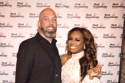 Candiace Dillard and Chris Basset at a RHOP event