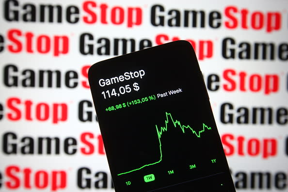 In this photo illustration, the GameStop (GME) stock price and a chart are seen on a smartphone screen.