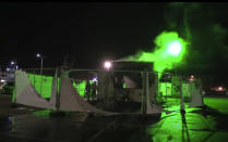 In this image made from video, a burnt out COVID-19 testing center is seen after being set on fire in Urk, 80 kilometers (50 miles) northeast of Amsterdam, Saturday, Jan. 23, 2021. Dutch police have clashed with protesters demonstrating against the country’s lockdown in the capital, Amsterdam and the southern city of Eindhoven. The unrest comes a day after rioting youths protesting on the first night of the country’s curfew torched a coronavirus testing facility in Dutch fishing village Urk. (Pro News via AP)