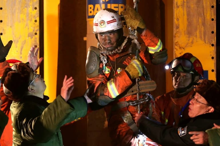 Rescuers free a miner trapped underground for 36 days in Pingyi County, eastern China's Shandong province on January 29, 2016