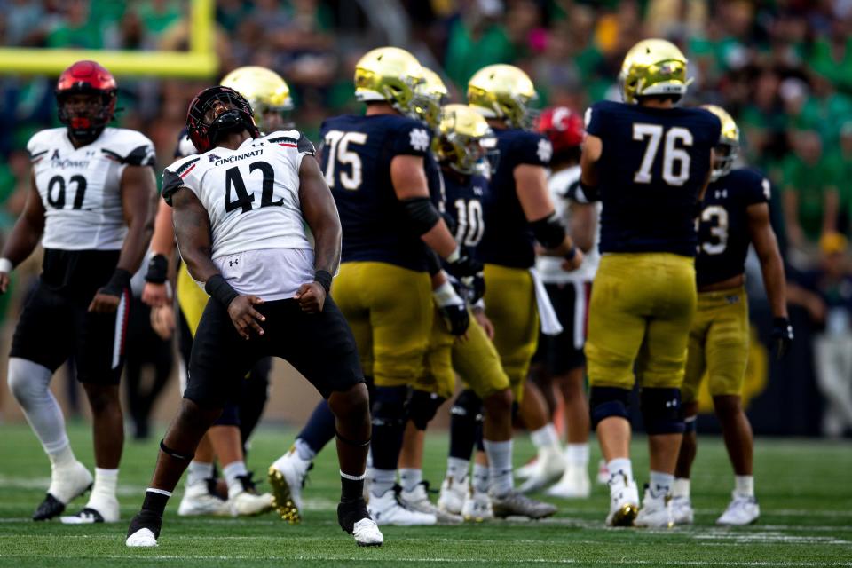 Cincinnati Bearcats defensive lineman Malik Vann (42) celebrates after a sack in the second half of the NCAA football game on Saturday, Oct. 2, 2021, at Notre Dame Stadium in South Bend, Ind. Cincinnati Bearcats defeated Notre Dame Fighting Irish 24-13.