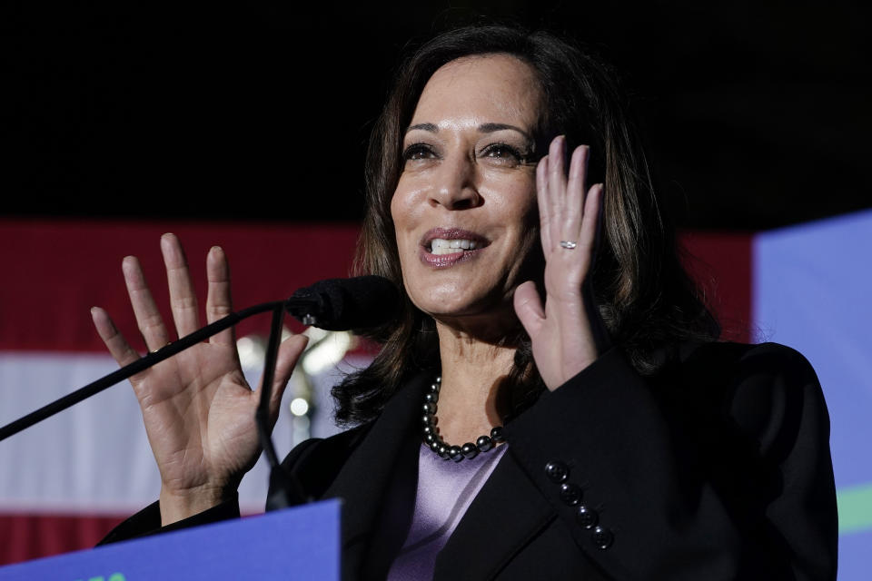 Vice President Kamala Harris gestures as she speaks at a campaign event for Democratic gubernatorial candidate, former Virginia Gov. Terry McAuliffe listens during a rally in Dumfries, Va., Thursday, Oct. 21, 2021. McAuliffe will face Republican Glenn Youngkin in the November election. (AP Photo/Steve Helber)