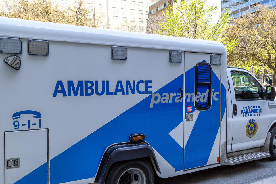 Toronto, Canada - May 16, 2020: Side view of a parked TPS ambulance car in Toronto; The City of Toronto Paramedic Services (TPS) is the statutory emergency medical services provider.