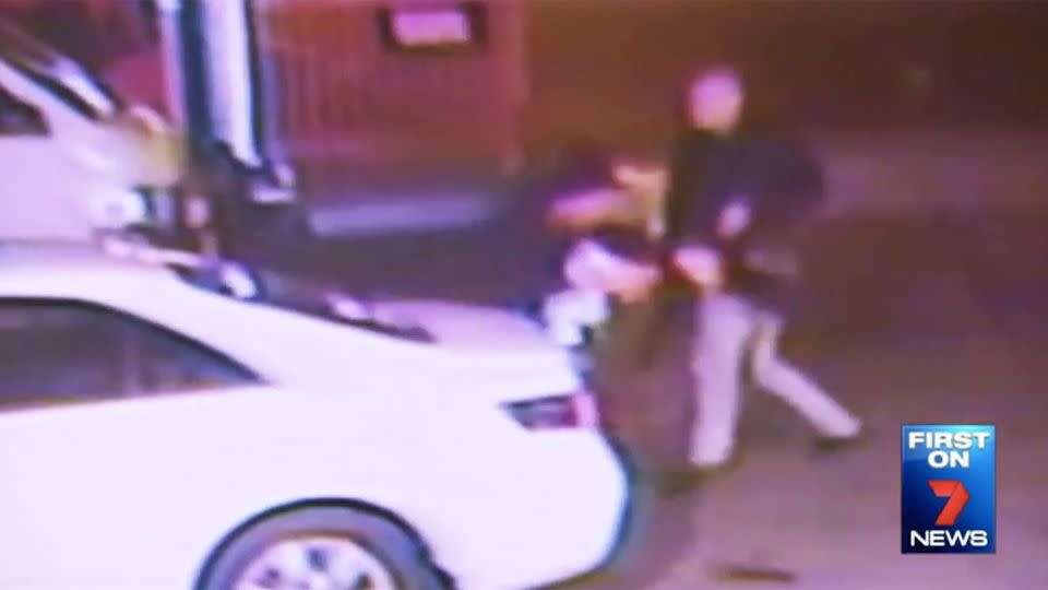 The thug can be seen punching Ranjett Sidhu in the head as the two scramble across the car park on Monday night. Photo: 7 News