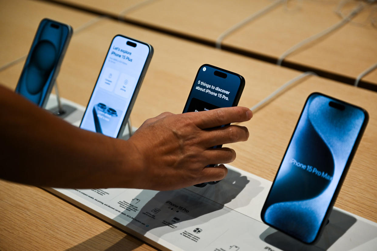 A customers looks at an iPhone 15s at the Apple store in Palo Alto, Calif (Tayfun Coskun / Anadolu Agency via Getty Images file )