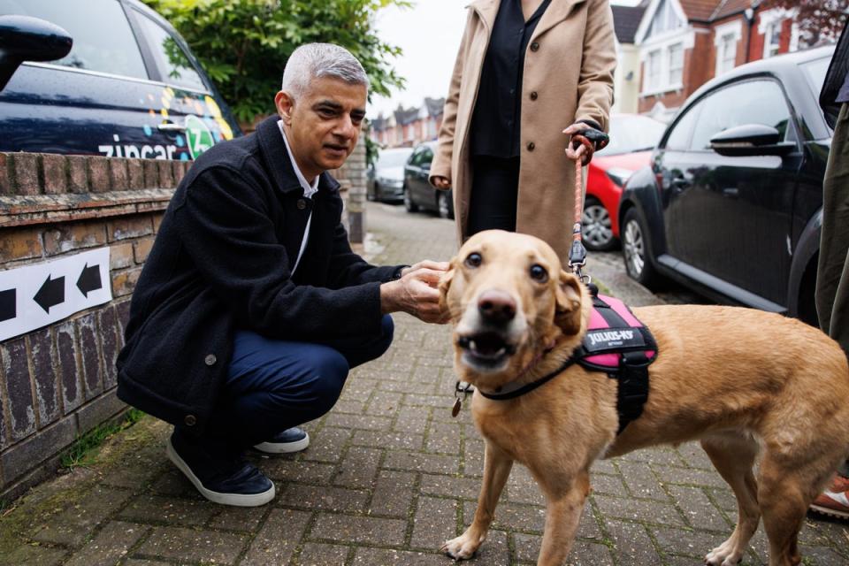 London mayor Sadiq Khan takes his dog with him to vote (EPA)