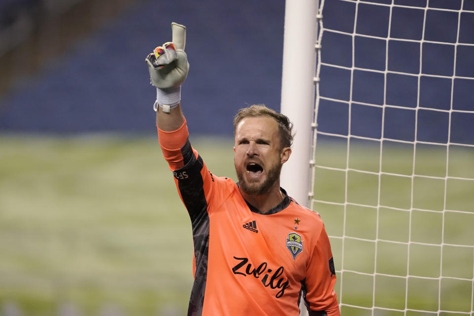 Seattle Sounders goalkeeper Stefan Frei lets out a yell after the team's 3-1 win over Los Angeles FC in an MLS playoff soccer match Tuesday, Nov. 24, 2020, in Seattle. (AP Photo/Ted S. Warren)