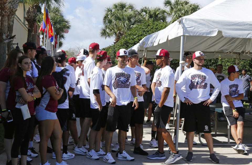 Marjory Stoneman Douglas baseball and softball players waiting to meet the the Marlins players before the start of a spring training baseball game against St. Louis Cardinals at Roger Dean Chevrolet Stadium on Friday, Feb. 23, 2018 in Jupiter, Fla. The Marlins honored Stoneman Douglas shooting victims with special hats, T-shirts, and patches. (David Santiago/Miami Herald/Tribune News Service via Getty Images)