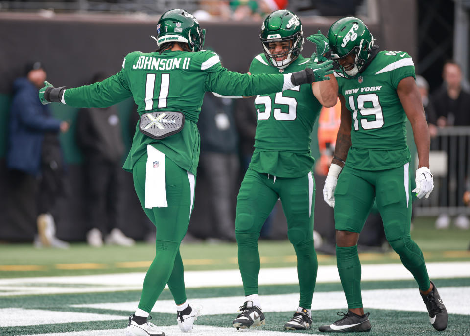 Dec 24, 2023; East Rutherford, New Jersey, USA; New York Jets linebacker Jermaine Johnson (11) celebrates his blocked punt with linebacker Chazz Surratt (55) and wide receiver <a class="link " href="https://sports.yahoo.com/nfl/players/34356" data-i13n="sec:content-canvas;subsec:anchor_text;elm:context_link" data-ylk="slk:Irvin Charles;sec:content-canvas;subsec:anchor_text;elm:context_link;itc:0">Irvin Charles</a> (19) during the first quarter against the Washington Commanders at MetLife Stadium. Mandatory Credit: Vincent Carchietta-USA TODAY Sports