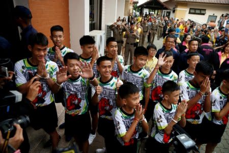 The 12 boys and their soccer coach who were rescued from a flooded cave arrive for a news conference in the northern province of Chiang Rai, Thailand. REUTERS/Soe Zeya Tun