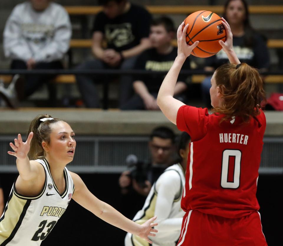 Purdue Boilermakers guard Abbey Ellis (23) defends Rutgers Scarlet Knights guard Jillian Huerter (0) during the NCAA women’s basketball game, Tuesday, Jan. 2, 2024, at Mackey Arena in West Lafayette, Ind. Purdue Boilermakers won 77-76.