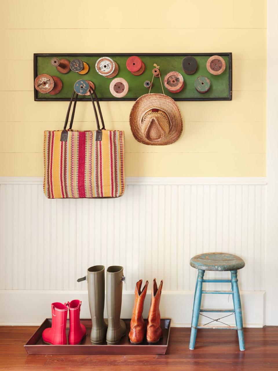 back door with yellow wall and white wainscoting