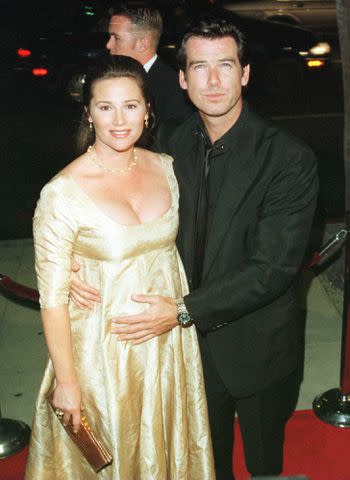 <p>Stewart Cook/Getty</p> Keely Shaye Smith and Pierce Brosnan in 1996