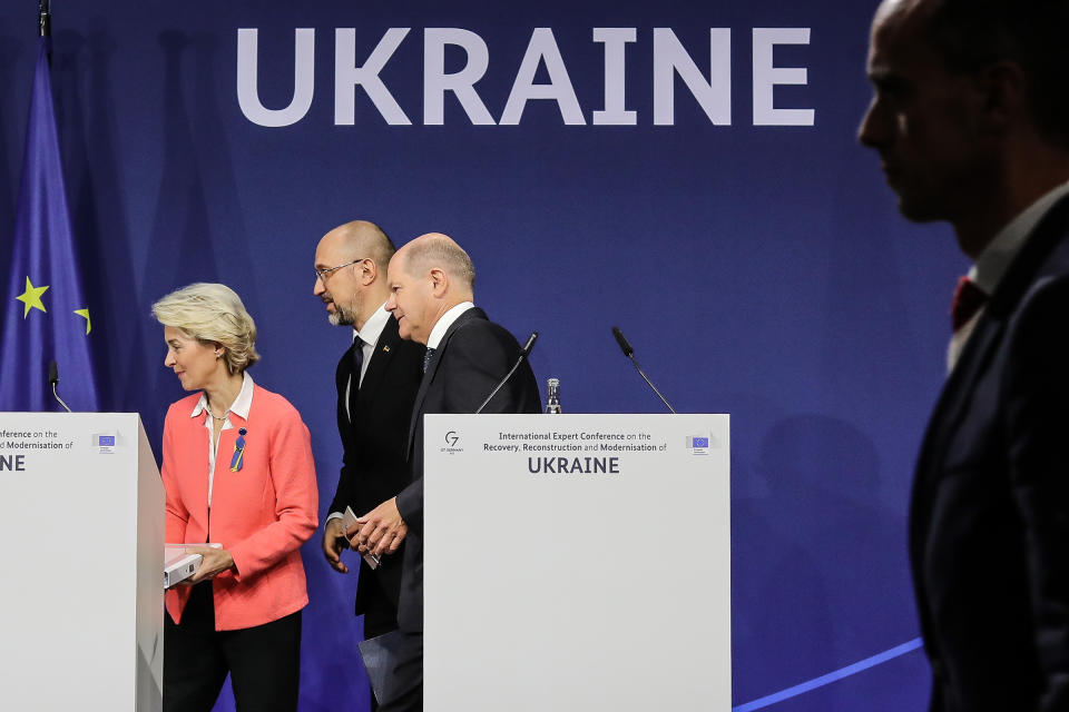 From left: President of the European Commission, Ursula von der Leyen, Prime Minister of Ukraine, Denys Shmyhal, and German Chancellor Olaf Scholz leave the stage following a press conference on Oct. 25, 2022 in Berlin. The German government is hosting political and world finance leaders to set the groundwork for Ukraine's eventual post-war reconstruction effort.<span class="copyright">Omer Messinger—Getty Images</span>