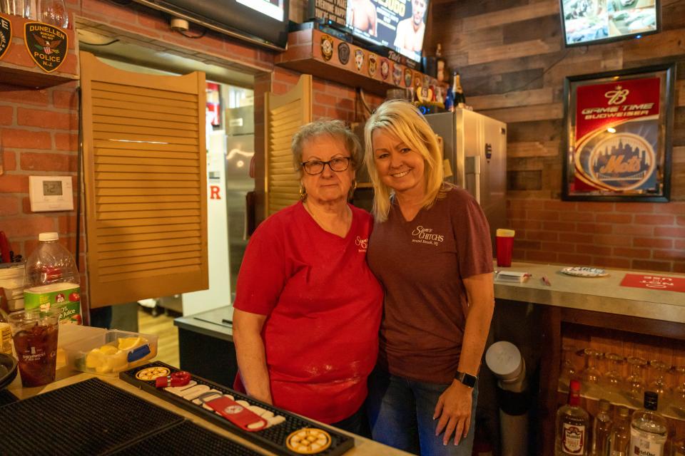 Renee Cote, left, and her mother, Myra Kurkowski, behind the bar counter at Stan's Chitch's Cafe.