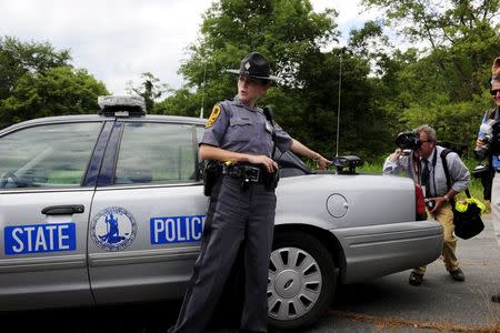 Virginia State Police Trooper Pamela Neff (L) addresses reporters about her traffic stop of Vester L. Flanagan, also known as Bryce Williams, off Highway I-66 in Fauquier County, Virginia August 26, 2015. REUTERS/David Manning