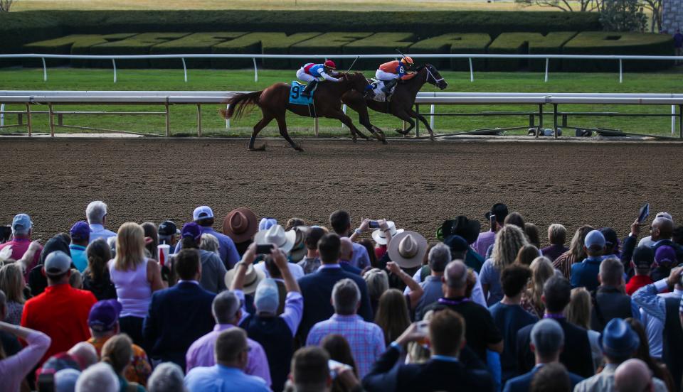 Giant Mischief trained by Brad H. Cox takes the lead on Bob Baffert-trained Arabian Lion in the final stretch during the fourth race during Friday&#39;s 2022 Breeders&#39; Cup World Championships at Keeneland in Lexington, Ky. Nov. 4, 2022.