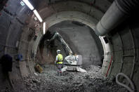 FILE PHOTO: An employee of French National Radioactive Waste Management Agency ANDRA works at the digging of a tunnel 500 meters underground at the Underground Research Laboratory of the Agency in Bure, Eastern France, June 11, 2012. REUTERS/Vincent Kessler/File Photo