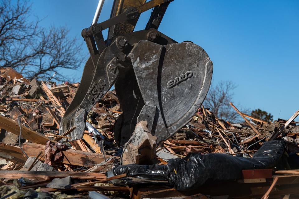 An excavator digs through rubble after the demolition of a former Radio Shack at 2505 S. College Ave. on Tuesday in Fort Collins.