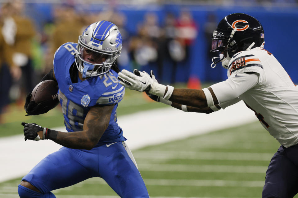 Detroit Lions running back Jahmyr Gibbs pulls away from Chicago Bears safety Eddie Jackson during the first half of an NFL football game, Sunday, Nov. 19, 2023, in Detroit. (AP Photo/Duane Burleson)