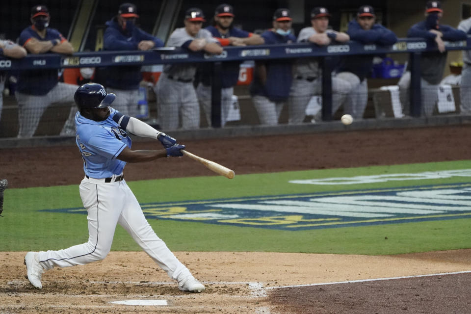 Tampa Bay Rays Randy Arozarena hits a solo home run against Houston Astros starting pitcher Framber Valdez during the fourth inning in Game 1 of a baseball American League Championship Series, Sunday, Oct. 11, 2020, in San Diego. (AP Photo/Ashley Landis)