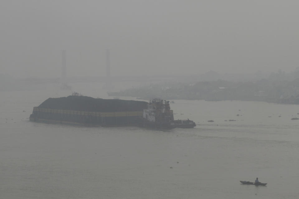 A boat sails on Musi River as thick haze from forest fires shroud the city of Palembang, South Sumatra, Indonesia, Monday, Oct. 2, 2023. Officials on Indonesia’s Sumatra island on Monday asked residents to work from home as more than 300 forest and peatland fires were causing widespread haze in the region. (AP Photo/Muhammad Hatta)