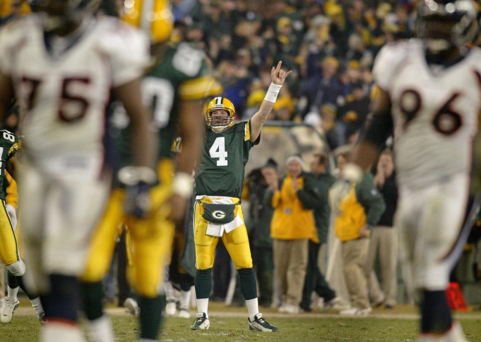 Green Bay Packers Brett Favre reacts after Ahman Green runs 98 yards for a touchdown against Denver.