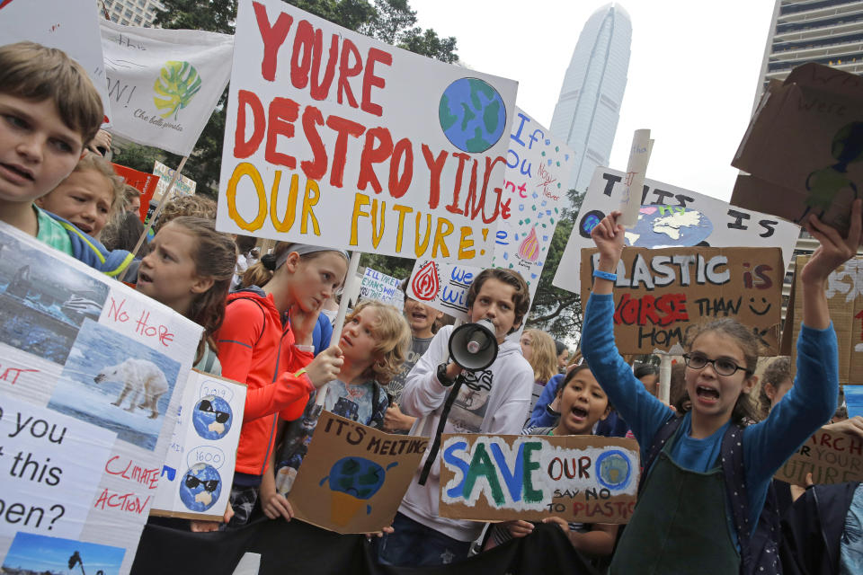 Hundreds of schoolchildren take part in a climate protest in Hong Kong, Friday, March 15, 2019. Students in more than 80 countries and territories worldwide plan to skip class Friday in protest over their governments' failure to act against global warming. The coordinated 'school strike' was inspired by 16-year-old activist Greta Thunberg, who began holding solitary demonstrations outside the Swedish parliament last year. (AP Photo/Kin Cheung)